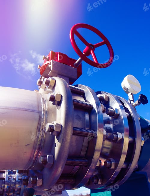 Preview: Industrial Zone, Steel Pipelines And Valves Against Blue Sky