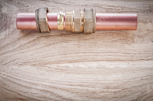 Preview: Copper Water Pipe Threaded Nipple Hose Connectors On Wooden Board Plumbing Concept.