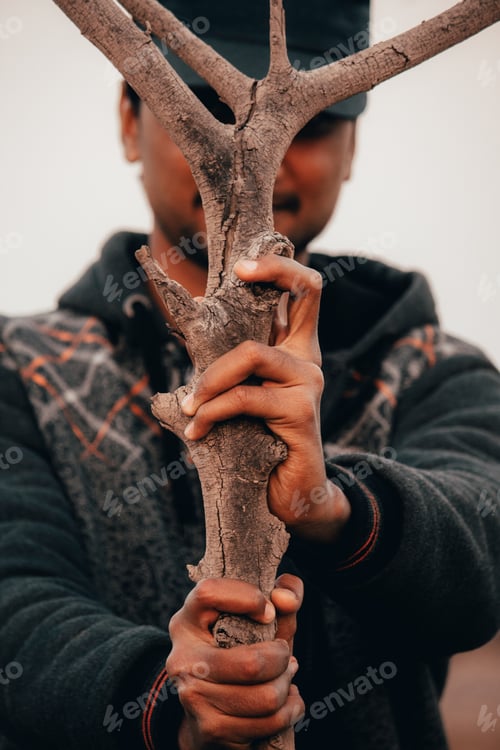 Preview: Indian Man Holding Stick In Front Of The Camera