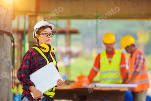 Preview: Female Inspectors And Architects Discuss With Head Engineer About Construction Project.Multi-Ethnic