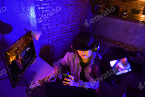 Preview: Asian Female Video Blogger,Woman Vlogger Makes A Video Stream On The Couch At Home.Professional