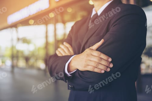 Preview: Blurry Of Successful Businessman Arms Crossed In Black Suit.
