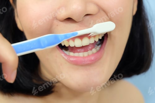 Preview: Woman Brushing Teeth With Toothbrush