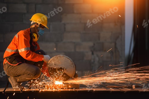 Preview: Industrial Worker Cutting And Welding Metal With Many Sharp Sparks,Worker Cutting Metal With