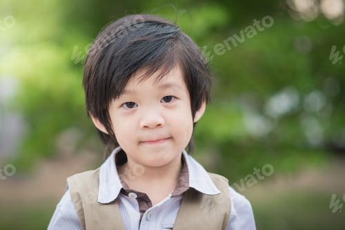 Preview: Happy Asian Boy Smiling And Looking At Camera Portrait