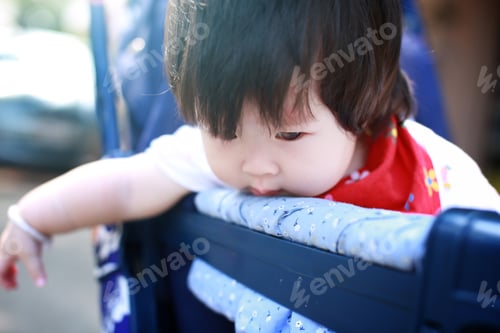 Preview: Happy Baby Girl In Stroller