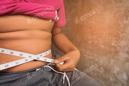 Preview: Boy Belly Fat With Tape Measure Weight Loss Around Body On Black Background. Healthy And Lose