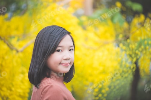 Preview: Close Up Of Beautiful Asian Girl With Golden Shower Tree Background In Thailand,Thailand Travel