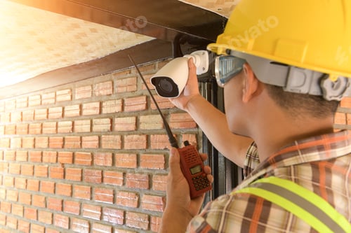 Preview: Technician Installing Cctv Camera For Security