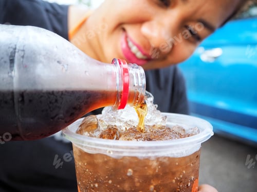 Preview: Woman Pouring Cola Drink
