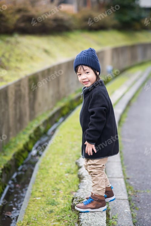 Preview: Cute Asian Child Playing In The Park