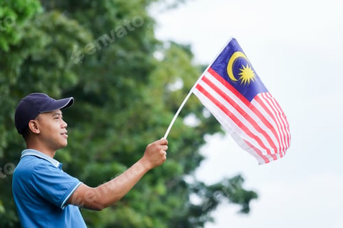 Preview: Independence Day Concept -Asian Young Man Holding A Malaysian Flags.