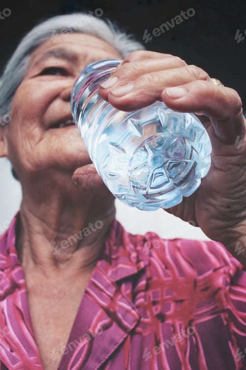 Preview: Senior Woman Drinking Water Bottle