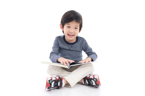 Preview: Cute Asian Boy Reading A Book On White Background Isolated