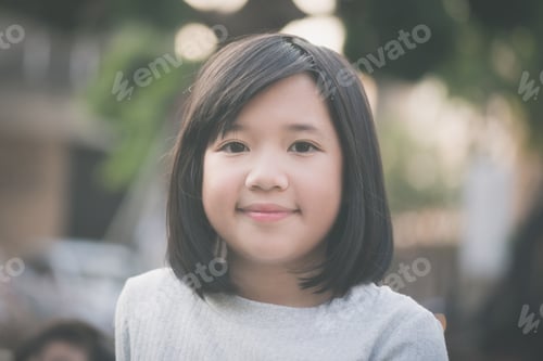 Preview: Happy Little Asian Girl Looking At Camera
