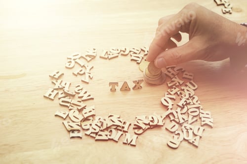 Preview: Word Tax With Stacked Coins On Wood Background. Digital Business Lifestyle Concept.