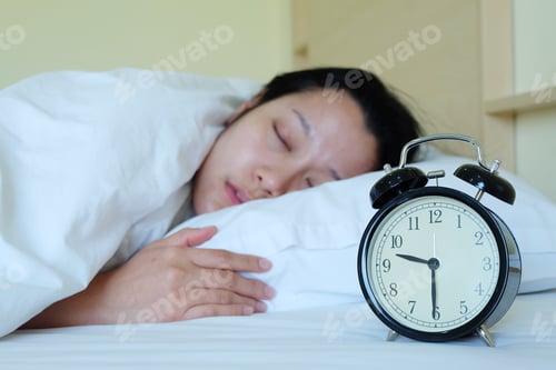 Preview: Woman Sleeping And Alarm Clock