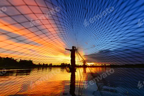 Preview: The Silluate Fisherman Trowing The Nets On Boat In River At During Sunrise,Thailand