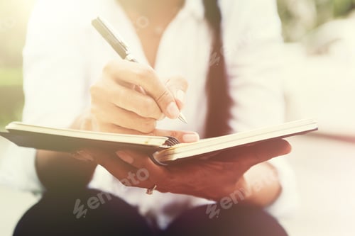 Preview: In Selective Focus Of Business Woman Writing Down Her Thoughts In The Notebook