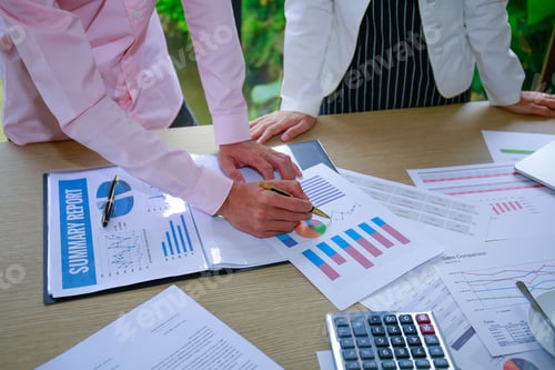 Preview: Finance,Accounting,Businesswomen,Businessman Analyzing Investment Charts With Calculator Laptop