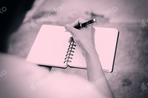 Preview: In Selective Focus Of Business Woman Writing Down Her Thoughts In The Notebook