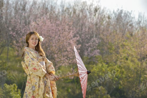 Preview: Japanese Girl In Traditional Dress Called Kimono With Sakura Blossom