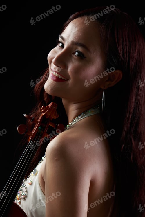 Preview: Southeast Asian Violinist, Beautiful Asian Woman Playing Violin On Black Background.