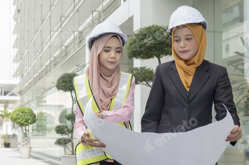Preview: Business Woman Engineers Developer Holding Blueprint On Street.