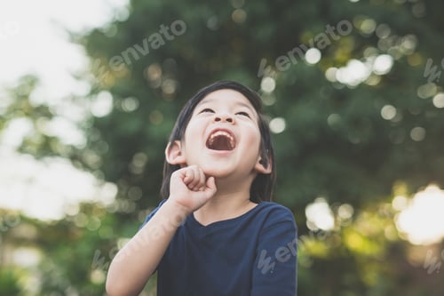 Preview: Cute Asian Boy Looking Up Outdoors