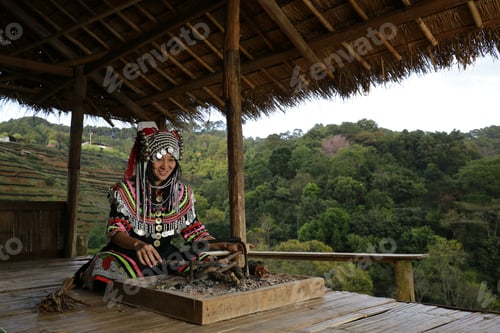 Preview: Hill Tribe Asian Woman In Traditional Clothes Collecting Tea Leaves With Basket In Tea Plantations