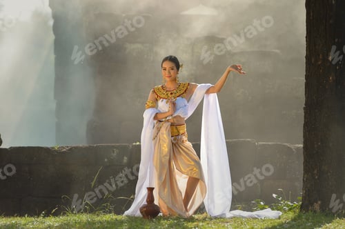 Preview: Asian Woman Wearing Traditional Thai Culture In Pagoda Chaiworaman No.7 Wiht Candle Light On During