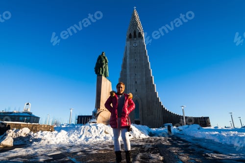 Preview: Hallgrimskirkja Is A Lutheran Parish Church Cathedral In Reykjavik, Iceland With Female Asian