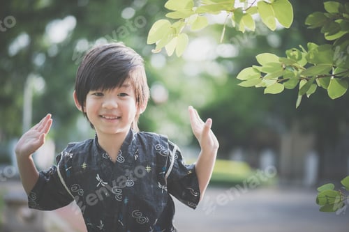 Preview: A Little Lovely Boy In A Kimono Playing In A Park On A Sunny Summer Day