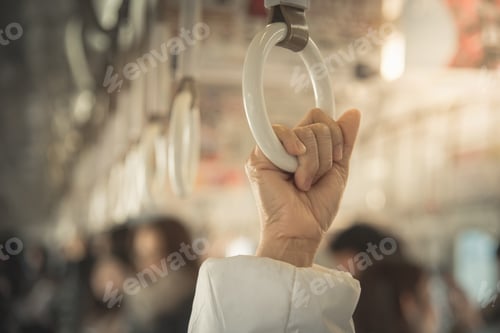 Preview: Elder Woman'S Hand Holding A Handle On Train.