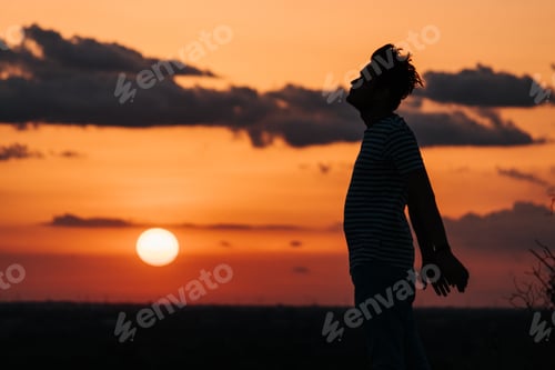 Preview: Silhouette Of An Indian Man Standing In Front Of The Sun During The Sunset