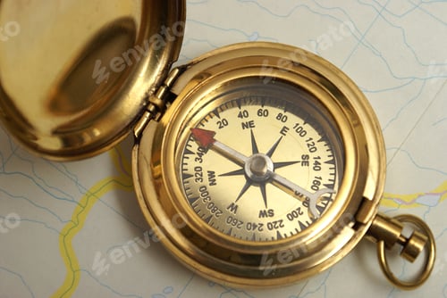Preview: A Macro Shot Of A Navigating Compass On Top Of A Recreational Map.