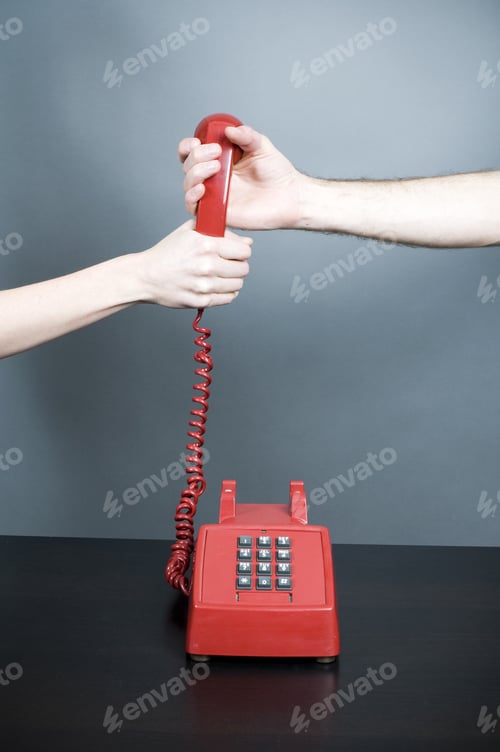 Preview: Woman And Man Holding Telephone Handset