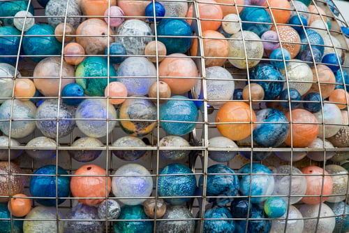Preview: Many Colored Glass Balls In A Cage In Venice