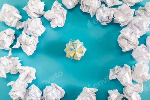 Preview: Crumpled Paper Balls On A Blue Background