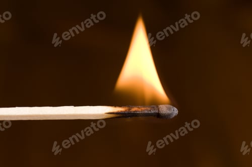 Preview: A Match With A Flame Burning On The End.