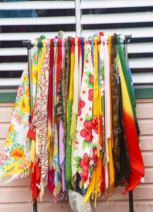 Preview: Bright Colorful Fabrics At An Outdoor Market By White And Green Vents