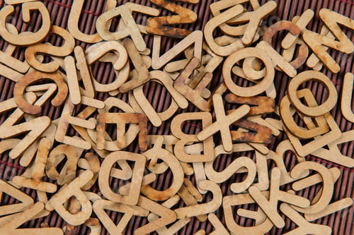 Preview: Wooden Fonts Scattered Disorderly On The Table. Top View