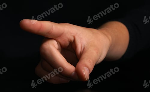 Preview: An Isolated Hand Pointing The Finger Over Black.