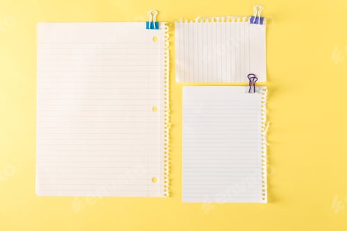 Preview: Blank Sheets Of Paper On A Yellow Background