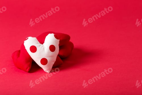 Preview: Handmade Heart Cushions On A Red Background