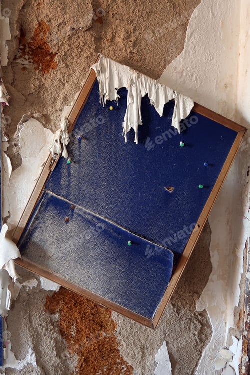 Preview: Crooked Bulletin Board On A Distressed Wall. Natural Light.
