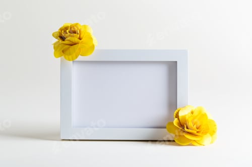 Preview: Blank White Picture Frame With Flowers On A White Background