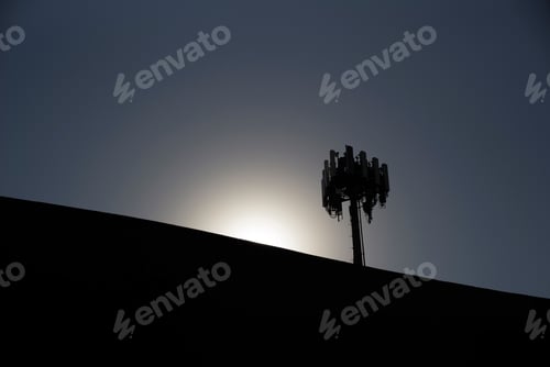 Preview: A Cluster Of Microwave Antennas Is Silhouetted By The Rising Sun.
