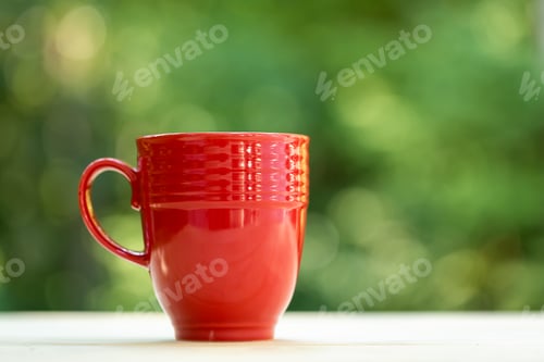 Preview: A Coffee Mug On A Shiny Green Forest Background