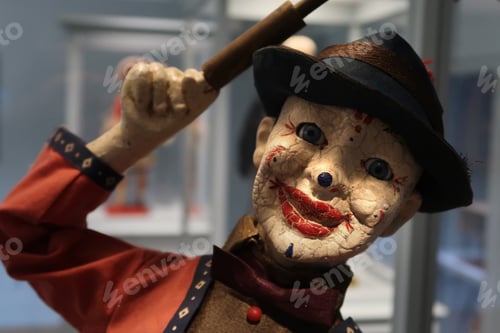 Sinister Antique Clown Doll with Hat Close-up